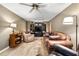 Cozy living room featuring comfortable recliners, leather sofa, and entertainment center at 205 Wellesley Ct, Woodstock, GA 30189