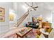 Open living room with high ceilings, large windows and a staircase to the upper level at 205 Wellesley Ct, Woodstock, GA 30189
