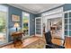 Cozy home office featuring a large window overlooking the yard, and a pair of french doors at 205 Wellesley Ct, Woodstock, GA 30189