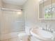 Bathroom featuring a vanity sink, medicine cabinet, and a shower with sliding glass doors at 2125 Perkerson Mill Rd, Austell, GA 30106