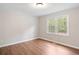 Cozy bedroom with hardwood floors, bright windows at 2125 Perkerson Mill Rd, Austell, GA 30106