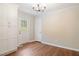 Charming dining area with hardwood floors, ample storage, wainscotting, and door to the back yard at 2125 Perkerson Mill Rd, Austell, GA 30106