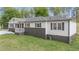Charming home exterior featuring dark shutters and a covered front porch at 2125 Perkerson Mill Rd, Austell, GA 30106