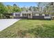 Charming single-story home with fresh exterior paint, well-kept lawn, and updated driveway at 2125 Perkerson Mill Rd, Austell, GA 30106