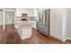Spacious kitchen featuring an island, stainless steel appliances, granite countertops, and white cabinets at 2125 Perkerson Mill Rd, Austell, GA 30106