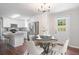 Eat-in kitchen with bright white cabinets, granite countertops, and stainless steel appliances at 2125 Perkerson Mill Rd, Austell, GA 30106