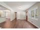 Living room with hardwood floors and large windows. Door that leads to a porch at 2125 Perkerson Mill Rd, Austell, GA 30106