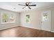 Bright living room featuring hardwood floors, a ceiling fan, and bright windows with a private view at 2125 Perkerson Mill Rd, Austell, GA 30106