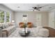 Bright living room with stylish furniture, ceiling fan, and large windows for natural light at 2125 Perkerson Mill Rd, Austell, GA 30106