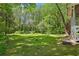 Spacious backyard with mature trees and lush green lawn at 2488 Glendale Se Cir, Smyrna, GA 30080