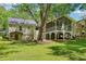 Large backyard features a beautiful screened-in porch and mature trees at 2488 Glendale Se Cir, Smyrna, GA 30080