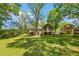 Lush, green backyard with mature trees and screened-in porch at 2488 Glendale Se Cir, Smyrna, GA 30080