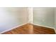 Bedroom with wood floors, grey walls, white trim and baseboards, and open doorway at 2488 Glendale Se Cir, Smyrna, GA 30080