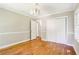 Bedroom with wood floors, neutral walls, and a large closet perfect for storage at 2488 Glendale Se Cir, Smyrna, GA 30080