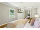 Bedroom with white trim, built-in shelving, mirrored closet, and a decorative chandelier at 2488 Glendale Se Cir, Smyrna, GA 30080