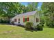 Cozy home with red shutters surrounded by mature trees and a lush green lawn at 2488 Glendale Se Cir, Smyrna, GA 30080