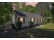 Charming home with red shutters, updated landscaping, and welcoming front entrance at 2488 Glendale Se Cir, Smyrna, GA 30080