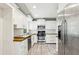 Spacious kitchen with white cabinets, butcher block countertops, and stainless steel appliances at 2488 Glendale Se Cir, Smyrna, GA 30080