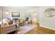 Inviting living room featuring hardwood floors, stylish furniture, and an open view to the kitchen at 2488 Glendale Se Cir, Smyrna, GA 30080