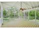 Large screened porch with a ceiling fan is perfect for relaxing outdoors at 2488 Glendale Se Cir, Smyrna, GA 30080