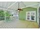 Relaxing screened-in porch with ceiling fan and views of the lush backyard at 2488 Glendale Se Cir, Smyrna, GA 30080