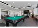 Inviting game room with a billiard table, comfortable seating, and a wall-mounted television at 855 Peachtree Ne St # 2706, Atlanta, GA 30308