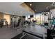 Spacious gym with weight machines, free weights, and floor-to-ceiling windows with a beautiful view at 855 Peachtree Ne St # 2706, Atlanta, GA 30308