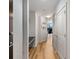 Inviting hallway featuring wood floors, white trim, and a view to the living room, enhancing the home's flow at 855 Peachtree Ne St # 2706, Atlanta, GA 30308