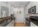 Stylish kitchen with white cabinets, granite countertops, and modern appliances, creating an inviting cooking space at 855 Peachtree Ne St # 2706, Atlanta, GA 30308
