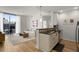 Bright living room with a modern kitchen, a comfortable sofa, and a large window with city views at 855 Peachtree Ne St # 2706, Atlanta, GA 30308