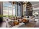 Spacious living room with floor-to-ceiling windows and stylish decor at 855 Peachtree Ne St # 2706, Atlanta, GA 30308
