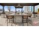 Outdoor bar with a covered pergola, bar stools, and city views at 855 Peachtree Ne St # 2706, Atlanta, GA 30308