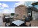 Outdoor fireplace with stone surround and comfortable seating area at 855 Peachtree Ne St # 2706, Atlanta, GA 30308