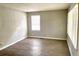 Bright bedroom with wood-look floors and neutral walls, offering a calm retreat at 955 Margaret Nw Pl, Atlanta, GA 30318