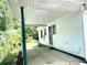 Spacious covered patio area, perfect for outdoor entertaining and relaxation at 955 Margaret Nw Pl, Atlanta, GA 30318
