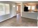 Open living space with modern flooring and lots of natural light, leading into the kitchen at 955 Margaret Nw Pl, Atlanta, GA 30318