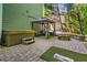 Paver patio featuring a hot tub, fire pit, gazebo, and golf area at 155 Glenside Ln, Duluth, GA 30097