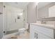 Updated bathroom features a glass enclosed shower, modern vanity with white cabinets, and neutral tile flooring at 155 Glenside Ln, Duluth, GA 30097
