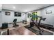 Fully equipped home gym, including free weights, workout bench, and exercise machines at 155 Glenside Ln, Duluth, GA 30097