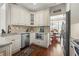 Well-appointed kitchen with stainless appliances, granite counters, and adjacent dining area at 155 Glenside Ln, Duluth, GA 30097
