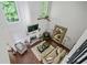 Aerial view of a living room with a fireplace, high ceilings, and hardwood flooring at 155 Glenside Ln, Duluth, GA 30097