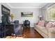 Comfortable home office with neutral walls, hardwood floors, and large window for natural light at 155 Glenside Ln, Duluth, GA 30097