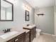 Bathroom featuring double sink vanity with granite countertop and tile flooring at 173 Michael Ln, Mcdonough, GA 30252