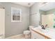 Bathroom featuring single sink vanity, white tile, and a shower and tub combination at 173 Michael Ln, Mcdonough, GA 30252