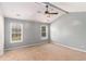 Spacious bedroom with neutral walls, two windows, ceiling fan, and plush carpeting at 173 Michael Ln, Mcdonough, GA 30252