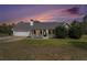 Charming single-story home featuring a welcoming front porch, attached garage, and well-maintained landscaping at 173 Michael Ln, Mcdonough, GA 30252