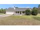 Charming single-story home featuring a welcoming front porch, attached garage, and well-maintained landscaping at 173 Michael Ln, Mcdonough, GA 30252