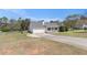 Front lawn and driveway lead up to a well-maintained ranch style house with an attached two-car garage at 173 Michael Ln, Mcdonough, GA 30252