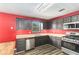 Traditional kitchen featuring gray cabinets, stainless steel appliances, and wood grain flooring at 173 Michael Ln, Mcdonough, GA 30252