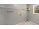 This is a view of the laundry room with shelving and utility connections at 173 Michael Ln, Mcdonough, GA 30252